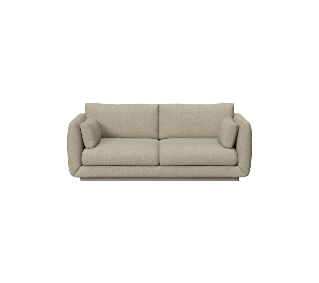 Bruine bank met pluche kussens in een moderne lounge-setting.